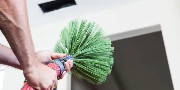 air duct repairman cleaner working